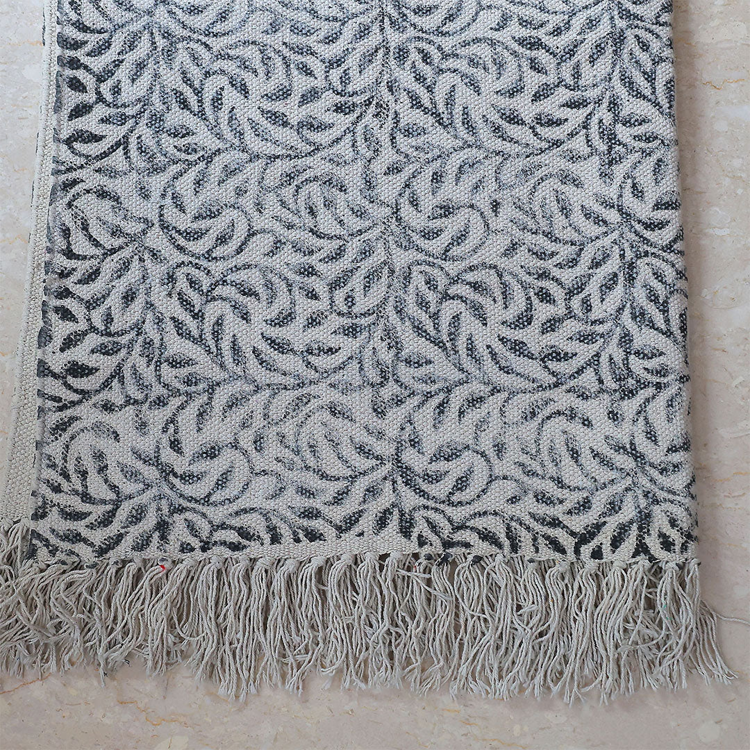 Monochrome Leaf Handwoven Cotton Rug – Black & Ivory with Fringe